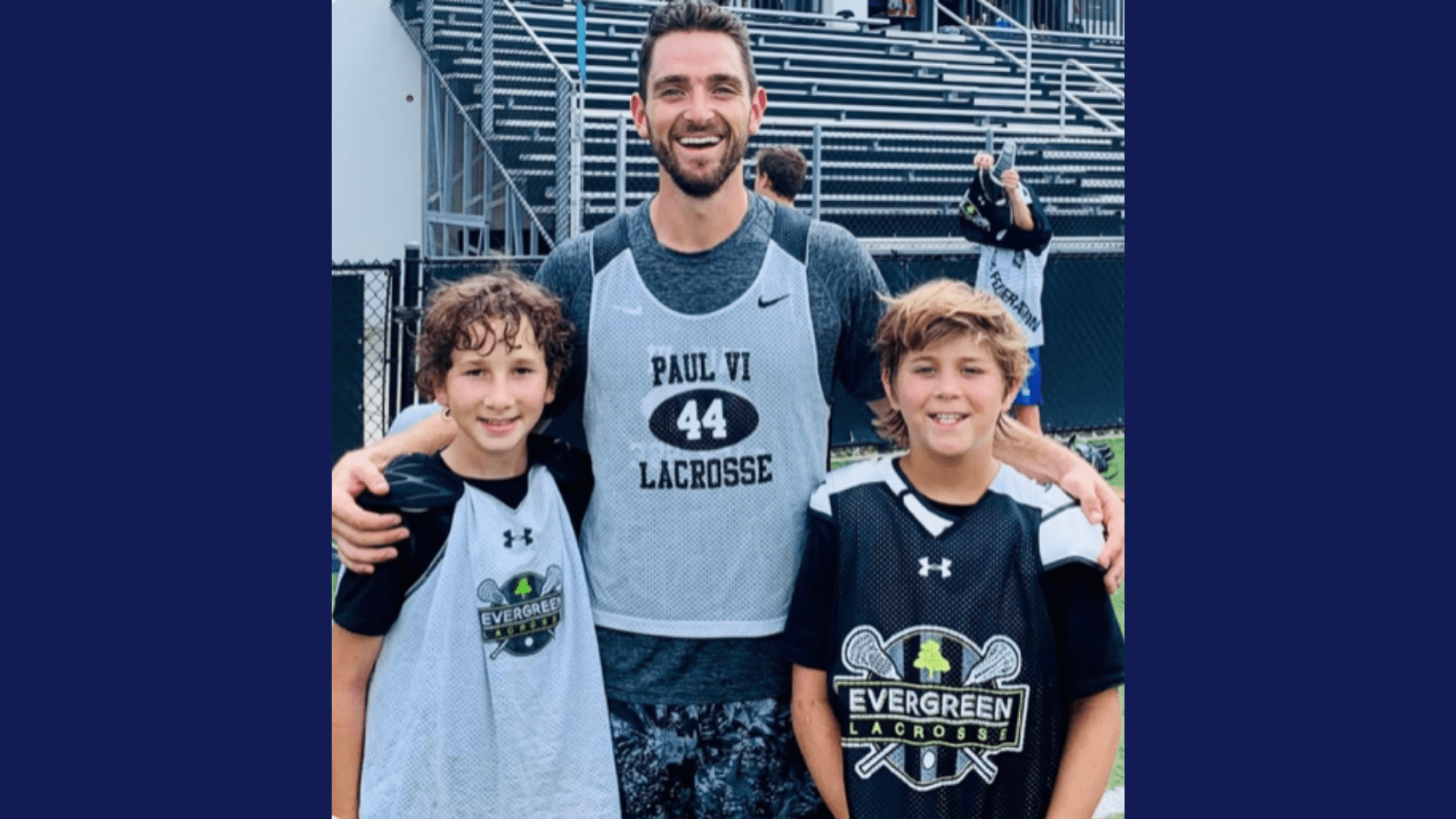 Sources of Strength Trainer Coach Mike Mabry with two lacrosse players